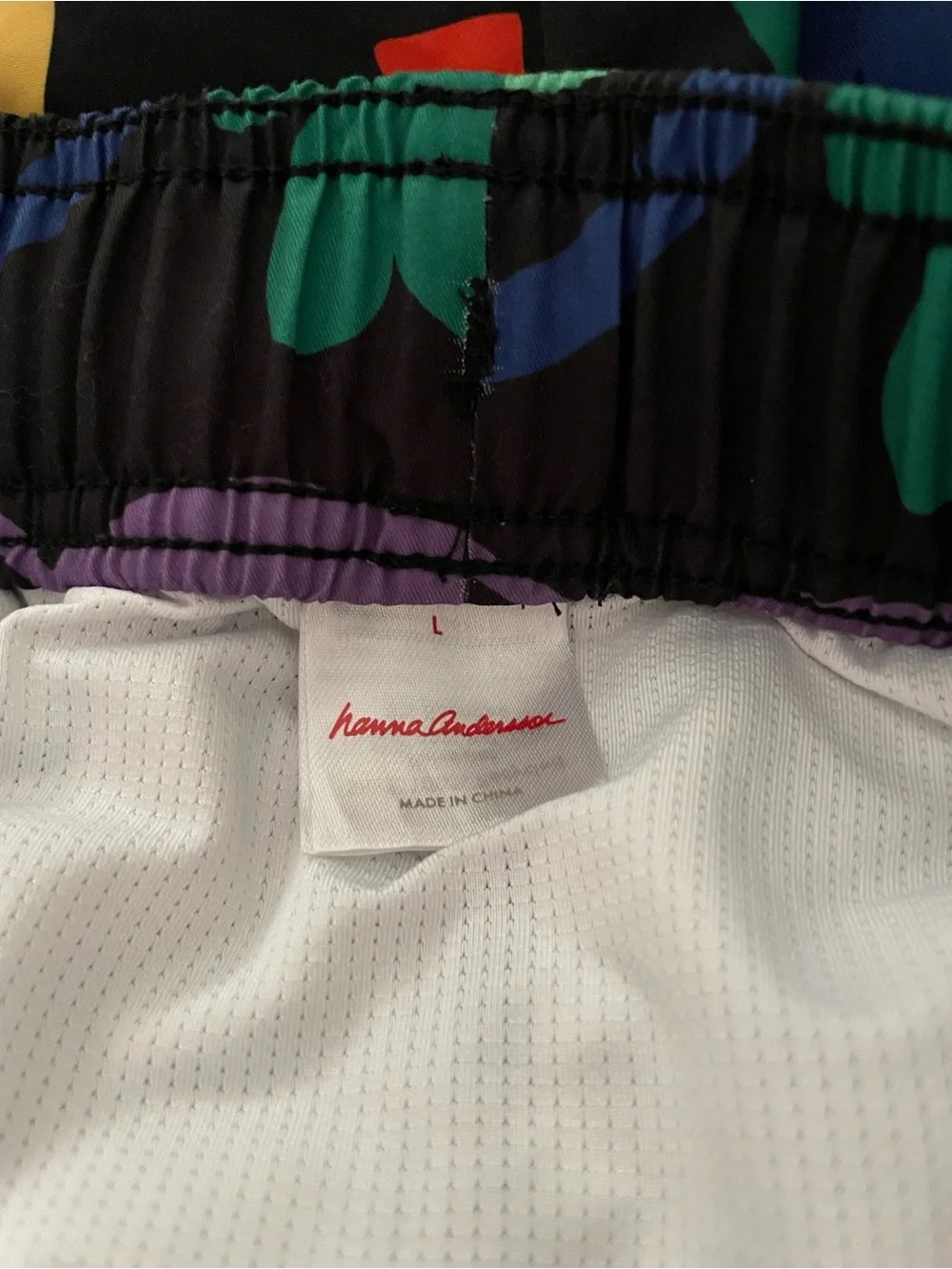 Hanna Andersson Black Swim Shorts with Bold Multicolor Abstract Print